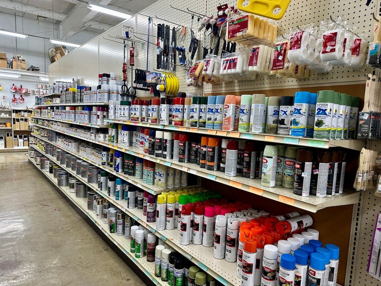 Arcola — illustrative photo (paint cans hardware store)