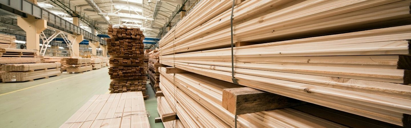 Diefenbaker — illustrative photo (stacked lumber planks warehouse)