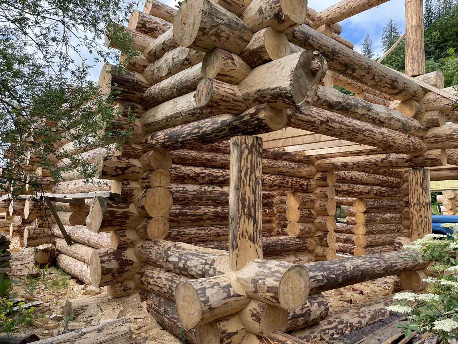 Millett — illustrative photo (log cabin timber frame)